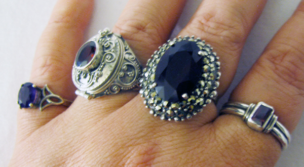 Left to right Amethyst Celtic knot ring poison ring with garnet 